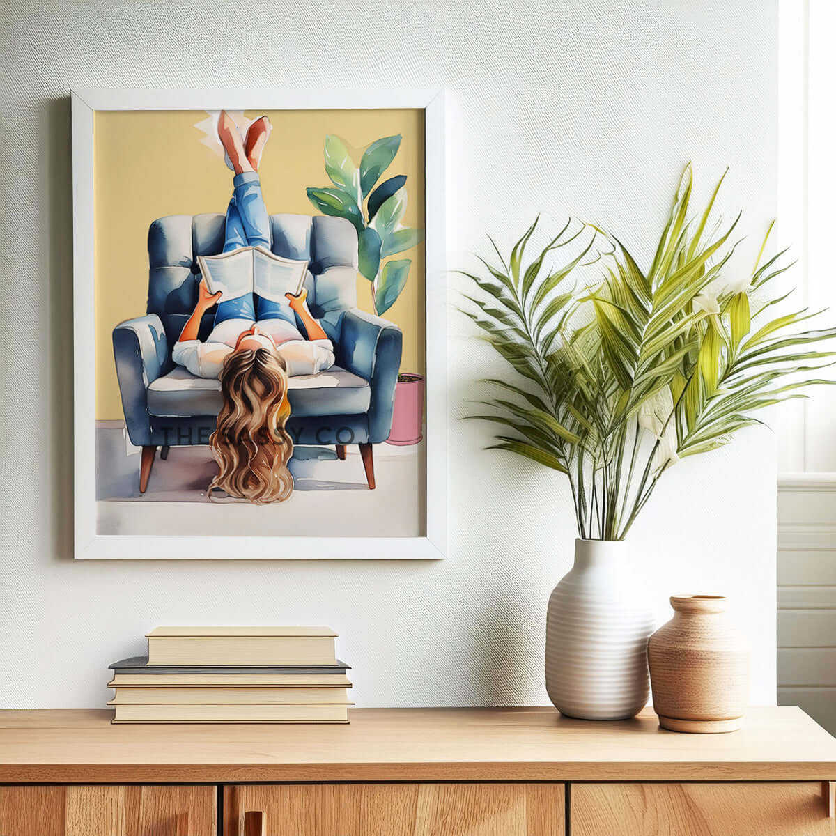 A yellow, blue boho style watercolor modern artwork of a woman reading book. Boho watercolor wall art painting canvas, framed art print for bedroom, living room, home wall decor. Boho wall decor ideas for modern Indian homes. Buy wall art painting online