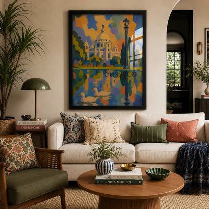 Victoria Memorial Kolkata black framed canvas wall art painting print, bold colorful abstract painting of the iconic domed marble monument in Kolkata with a vintage lamppost, cypress trees, and two ducks swimming in a reflective lake, rendered in bright orange, blue, and purple sunset tones, framed canvas wall art shown above a sofa in a living room, black frame canvas print for living room, bedroom, and office wall decor, Indian cityscape canvas art, Kolkata skyline