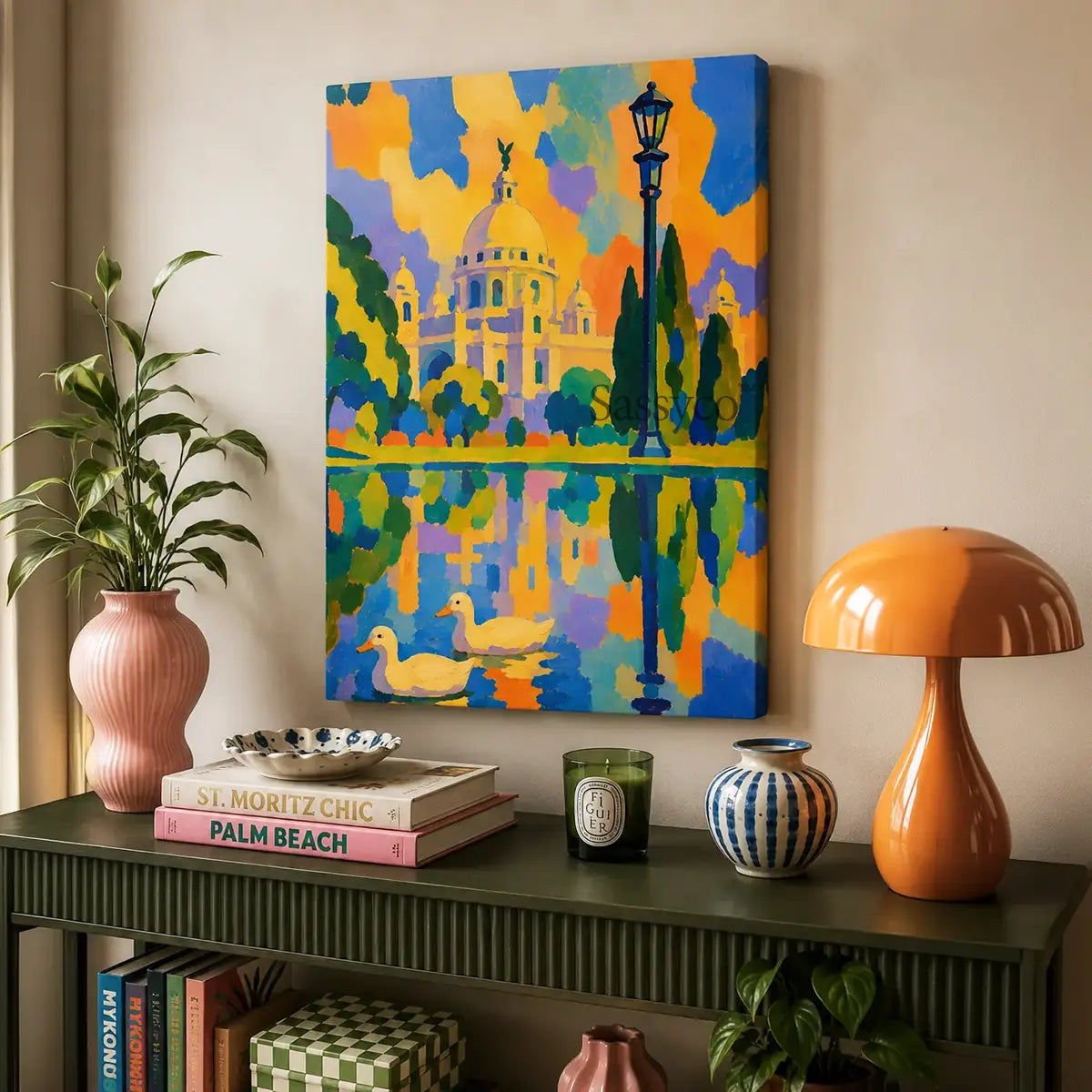 Victoria Memorial Kolkata gallery wrap canvas wall art painting print hung above a console table, bold colorful abstract painting of the iconic domed marble monument in Kolkata with a vintage lamppost, cypress trees, and two ducks swimming in a reflective lake, rendered in bright orange, blue, and purple sunset tones, ready to hang canvas wall art, gallery wrapped canvas print for living room and entryway wall decor, Indian cityscape canvas art, Kolkata skyline