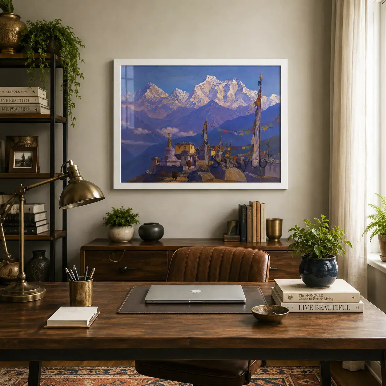 A blue Ladakh Himalayas India monastery mountain landscape with a Buddhist stupa, fluttering prayer flags and snow-capped peaks under a clear blue sky painting, framed canvas in black frame, styled in a home office with a desk, books etc - mountain canvas wall art, Himalayan landscape wall art, Ladakh travel poster artwork print for living room, bedroom and home office wall decor