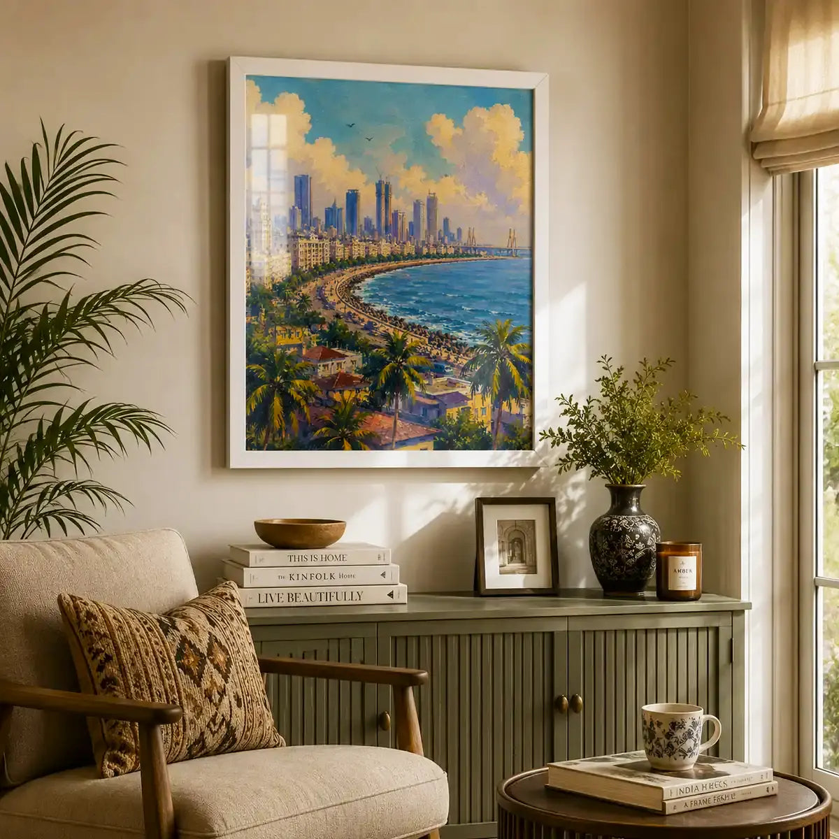 Mumbai India Marine Drive Queen's Necklace cityscape with the curving seafront promenade, palm trees, Bandra-Worli Sea Link and skyline under sunlit clouds wall art painting, framed in a clean white frame, styled in a living room with an armchair, cupboard, sitting space - Mumbai cityscape canvas wall art, India skyline wall art, Marine Drive poster artwork print for living room, bedroom and home office wall decor