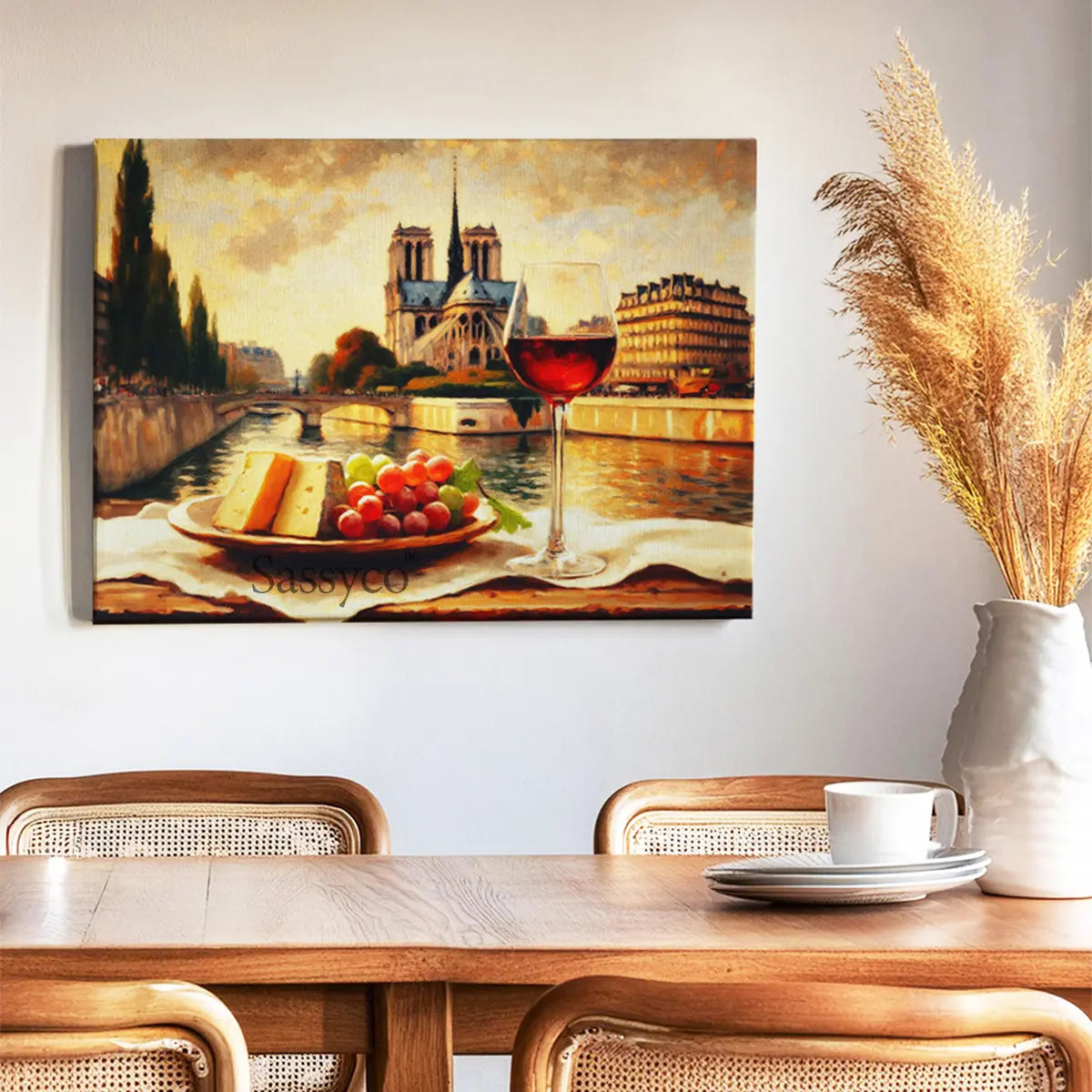 Dining room with a canvas painting of the Paris cityscape and table setting. a scenic cityscape with a glass of wine and cheese plate, branded 'Sassyco'. A vintage style Paris, France cityscape travel canvas oil painting wall art for modern kitchen, dining room wall decor. French style room decor. Aesthetic scenery for dining room wall art decor. 