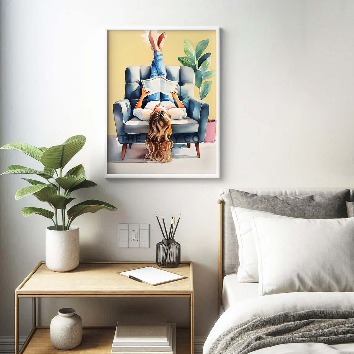 A yellow, blue boho style watercolor modern artwork of a woman reading book. Boho watercolor wall art painting canvas, framed art print for bedroom, living room, home wall decor. Boho wall decor ideas for modern Indian homes. Buy wall art painting online 