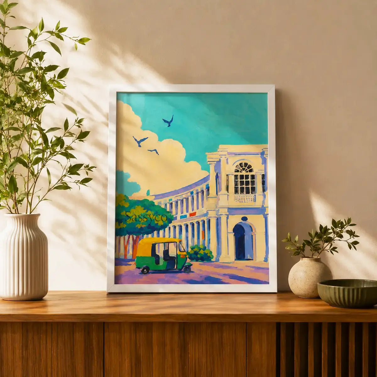 New Delhi Connaught Place India cityscape with colonial colonnades, a classic auto-rickshaw and birds soaring above aqua skies impressionist painting, styled on a console table in a living room - India travel wall art, Indian heritage canvas wall art, Delhi cityscape poster artwork print for living room, bedroom and home office wall decor