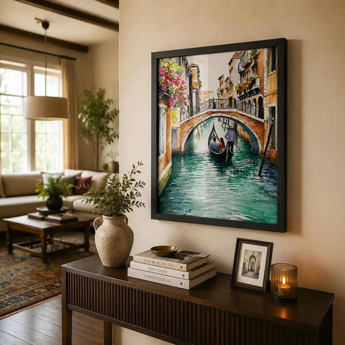 Venice Italy gondola canal cityscape with a gondolier rowing beneath a bougainvillea-draped stone bridge watercolor painting, styled above a console table entryway in a living room - Italy travel wall art, Europe cityscape canvas wall art, Venice poster artwork print for living room, bedroom and home office wall decor